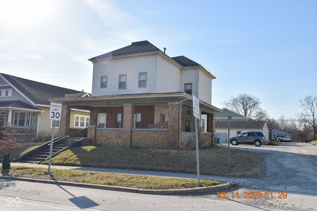 view of front of house with brick siding