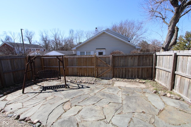 view of patio with a gate and a fenced backyard