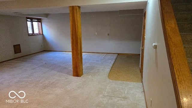 below grade area with baseboards and carpet floors