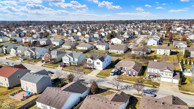 birds eye view of property with a residential view