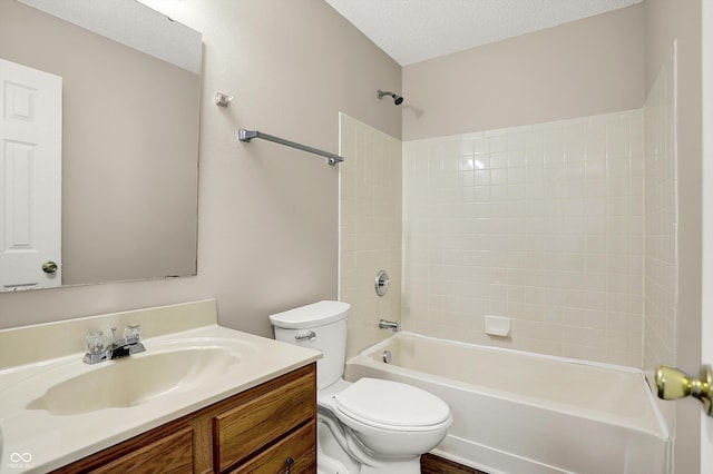 bathroom featuring vanity, shower / bath combination, toilet, and a textured ceiling