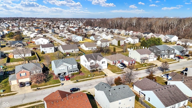 birds eye view of property with a residential view