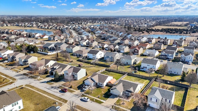 birds eye view of property featuring a residential view and a water view