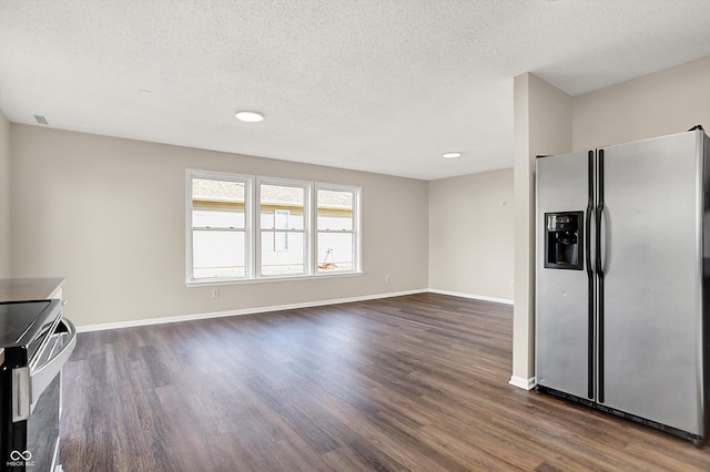 kitchen featuring dark wood-style floors, stainless steel fridge with ice dispenser, baseboards, and range with electric stovetop