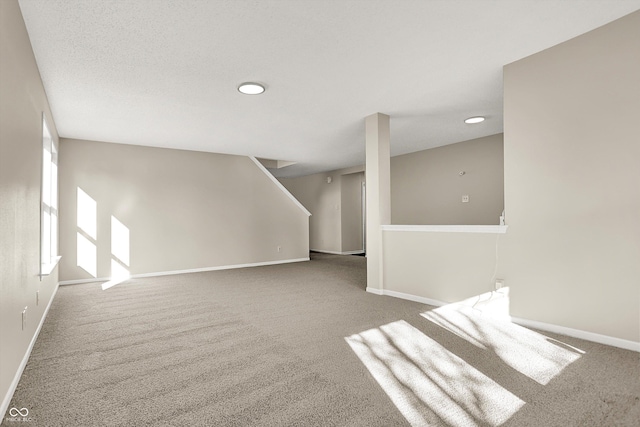 interior space with baseboards and a textured ceiling