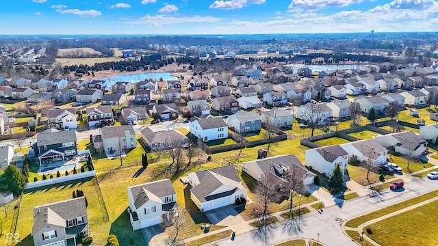 birds eye view of property with a residential view