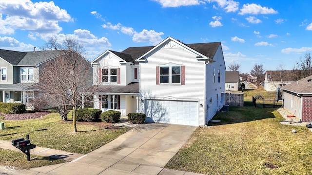 traditional home featuring a residential view, a garage, concrete driveway, and a front yard