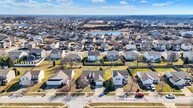 birds eye view of property featuring a residential view and a water view