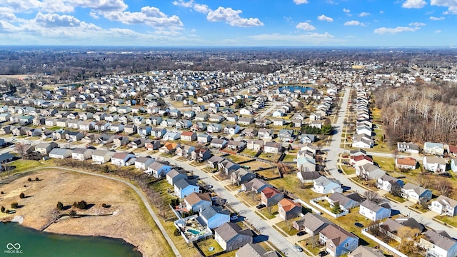 bird's eye view with a residential view and a water view