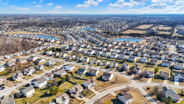 aerial view featuring a residential view and a water view