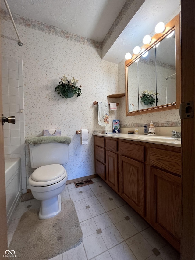 full bath with tile patterned floors, visible vents, wallpapered walls, and vanity