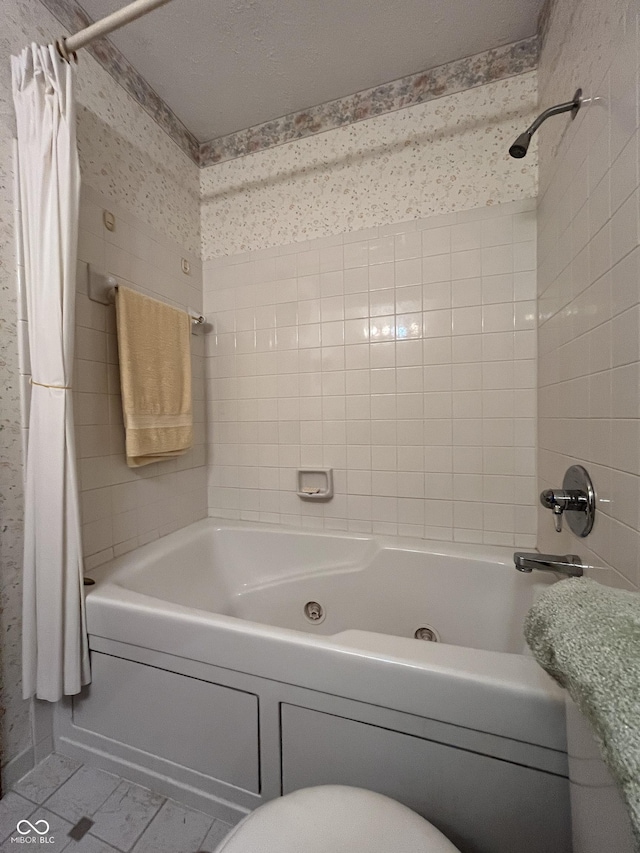 bathroom featuring wallpapered walls, toilet, and shower / tub combo with curtain