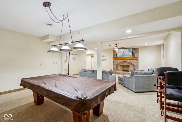 recreation room featuring visible vents, baseboards, recessed lighting, a brick fireplace, and light colored carpet