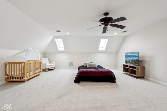 carpeted bedroom featuring visible vents, baseboards, ceiling fan, and vaulted ceiling