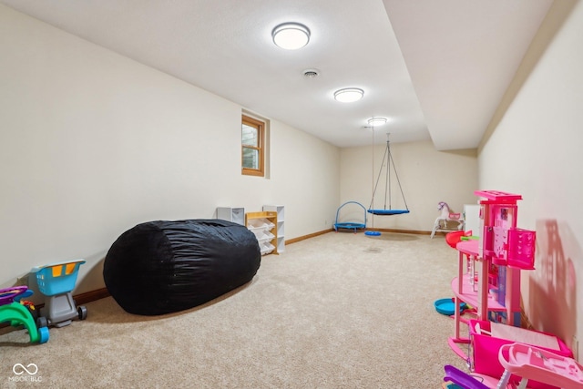 rec room featuring visible vents, baseboards, and carpet