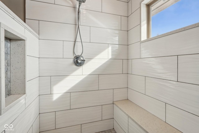 bathroom featuring a tile shower