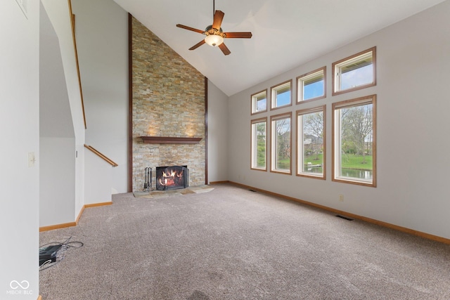 unfurnished living room featuring a ceiling fan, high vaulted ceiling, and baseboards