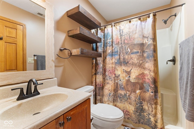 bathroom featuring visible vents, vanity, toilet, and a shower with curtain