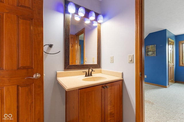 bathroom with vanity and baseboards