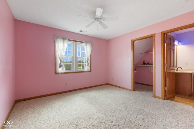 unfurnished bedroom featuring visible vents, carpet flooring, and baseboards