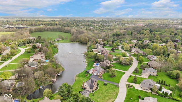 drone / aerial view featuring a residential view and a water view