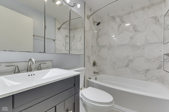 full bath featuring shower / bathtub combination, toilet, and vanity