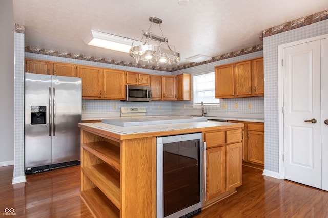 kitchen with open shelves, dark wood-style floors, a center island, wine cooler, and appliances with stainless steel finishes