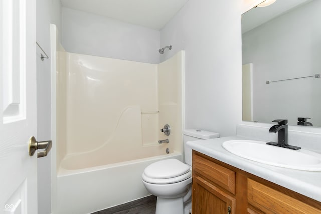 bathroom with shower / tub combination, toilet, vanity, and wood finished floors