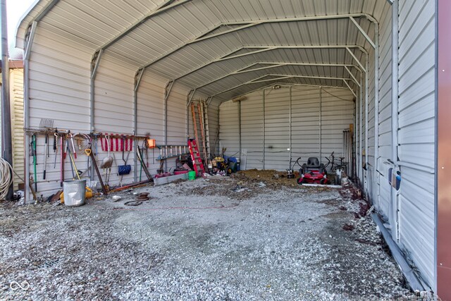 garage featuring a carport