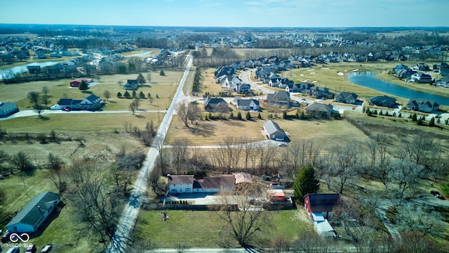 bird's eye view featuring a rural view, a water view, and a residential view