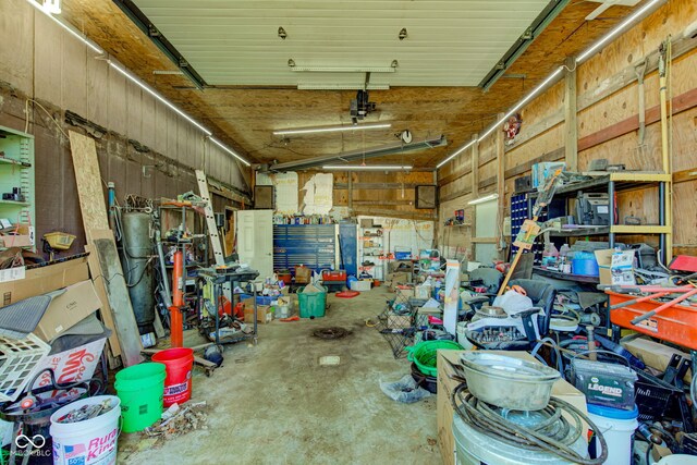 misc room with concrete floors and a garage