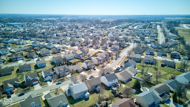 birds eye view of property with a residential view