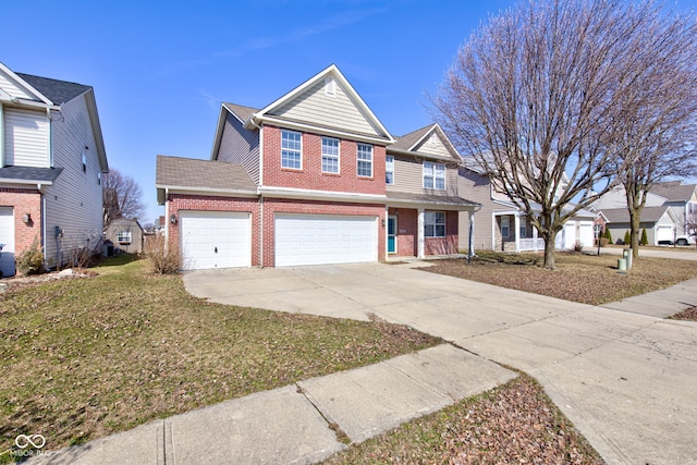 traditional-style house with concrete driveway, a garage, brick siding, and a front lawn