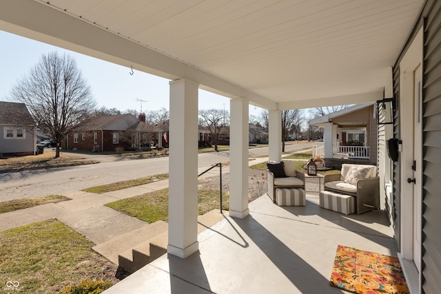 view of patio / terrace featuring a residential view and a porch