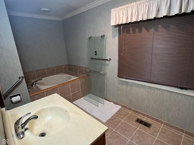 full bath featuring crown molding, walk in shower, a garden tub, tile patterned floors, and vanity