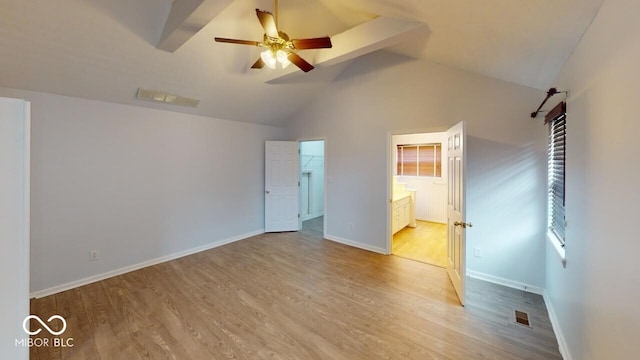 unfurnished bedroom with a spacious closet, visible vents, light wood-type flooring, and baseboards