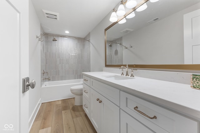 5189 Abbeygate Blvd, Bargersville, IN 46106 - full bathroom featuring visible vents, toilet, vanity, and wood finished floors