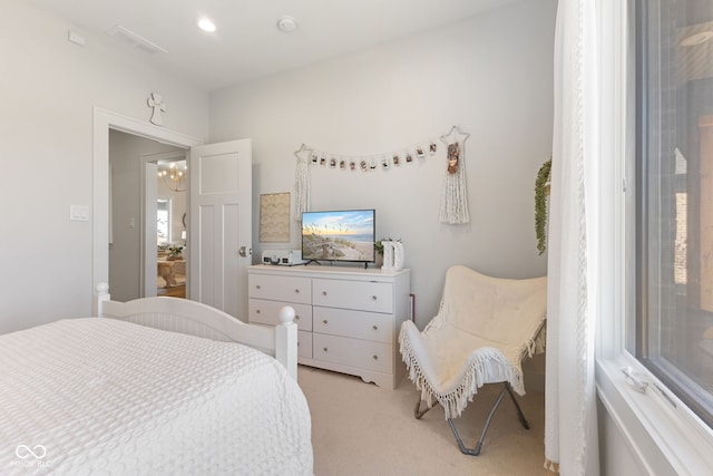 5189 Abbeygate Blvd, Bargersville, IN 46106 - bedroom featuring visible vents, light colored carpet, and a chandelier