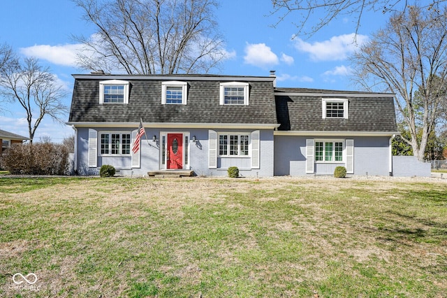 1310 Bowman Dr, Greenfield, IN 46140 - view of front of home with mansard roof, brick siding, roof with shingles, and a front yard