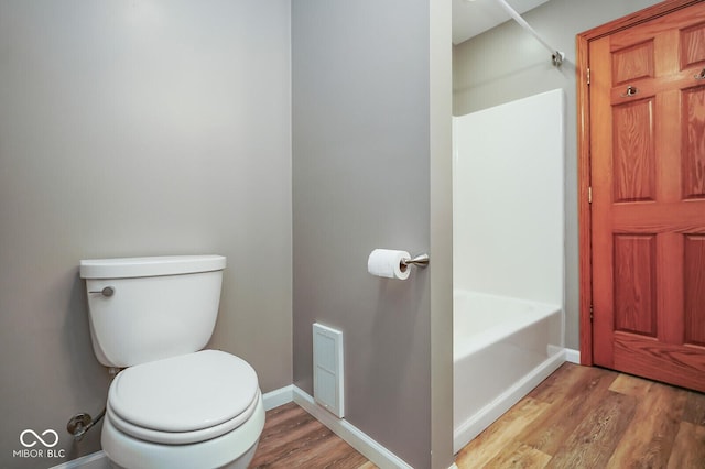 1310 Bowman Dr, Greenfield, IN 46140 - bathroom featuring visible vents, toilet, wood finished floors, and baseboards
