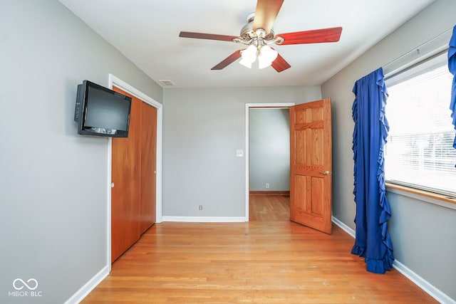 1310 Bowman Dr, Greenfield, IN 46140 - unfurnished bedroom with a closet, baseboards, visible vents, and light wood finished floors