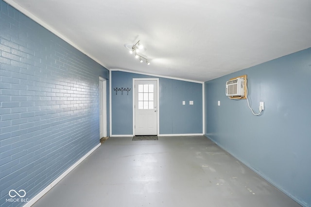 1310 Bowman Dr, Greenfield, IN 46140 - foyer entrance with finished concrete floors, baseboards, and a wall unit AC