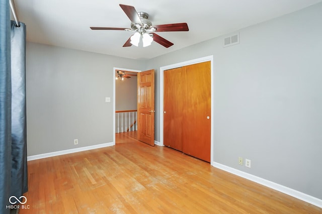 1310 Bowman Dr, Greenfield, IN 46140 - unfurnished bedroom featuring a closet, visible vents, baseboards, and light wood-style floors