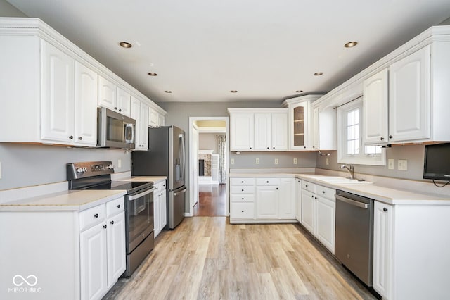 1310 Bowman Dr, Greenfield, IN 46140 - kitchen featuring a sink, stainless steel appliances, and white cabinetry