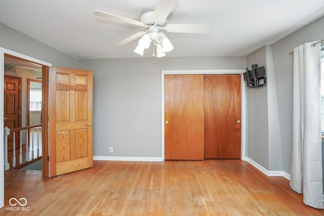 1310 Bowman Dr, Greenfield, IN 46140 - unfurnished bedroom featuring a closet, visible vents, light wood-style flooring, and baseboards