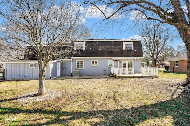 1310 Bowman Dr, Greenfield, IN 46140 - back of property with cooling unit, fence, roof with shingles, a wooden deck, and a yard