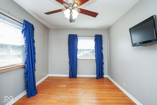 1310 Bowman Dr, Greenfield, IN 46140 - spare room featuring baseboards, ceiling fan, and light wood finished floors