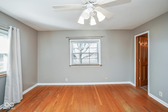 1310 Bowman Dr, Greenfield, IN 46140 - empty room with ceiling fan, baseboards, and wood finished floors