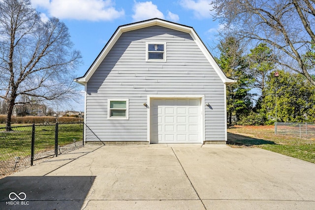 1310 Bowman Dr, Greenfield, IN 46140 - view of property exterior with a gambrel roof, an outbuilding, a detached garage, and fence