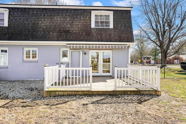 1310 Bowman Dr, Greenfield, IN 46140 - back of house with mansard roof, french doors, fence, and a shingled roof